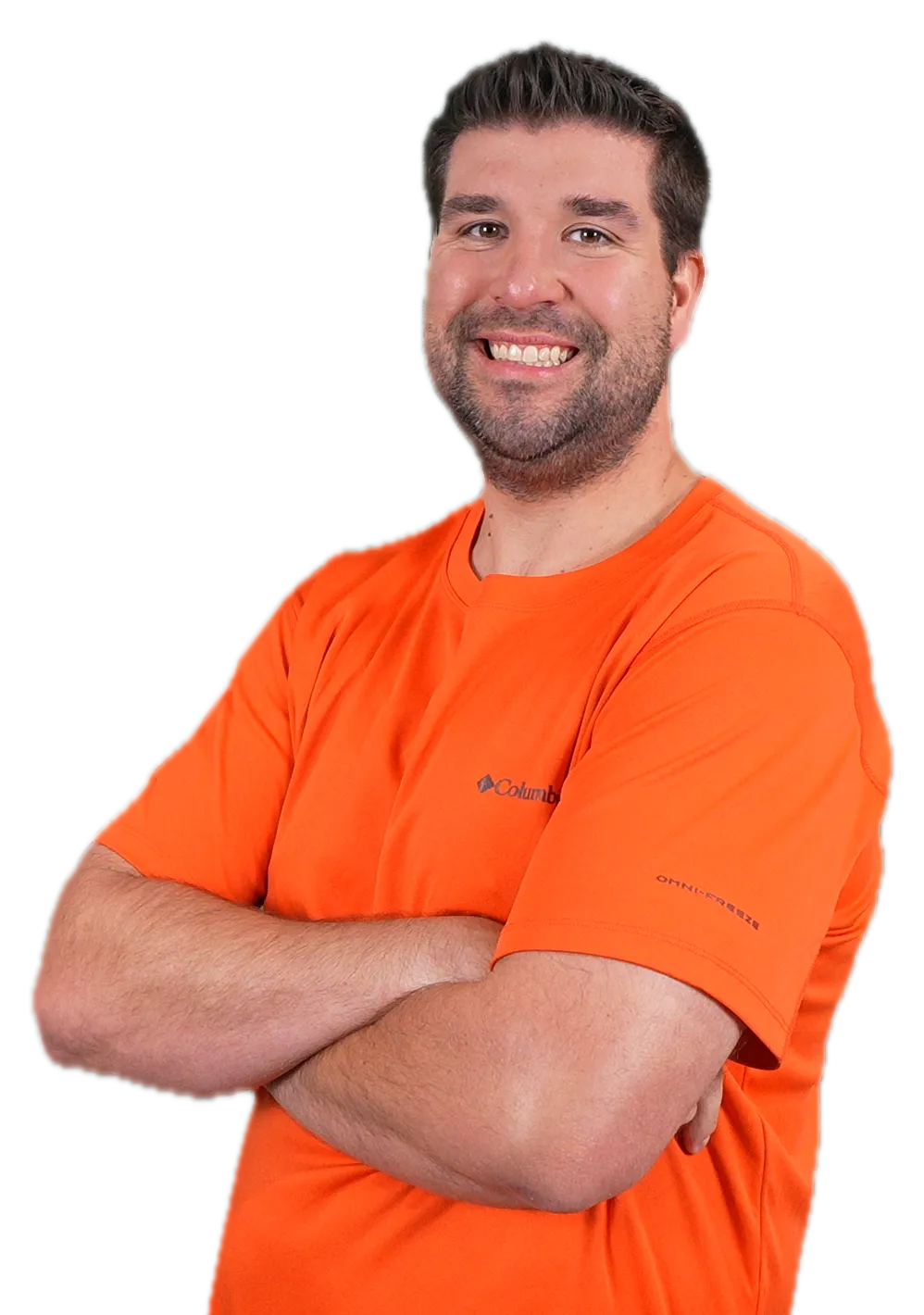 Jeremy standing with his arms crossed, smiling at the camera.